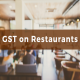 Image which Shows the text GST on Restaurents in a Restaurent Background.